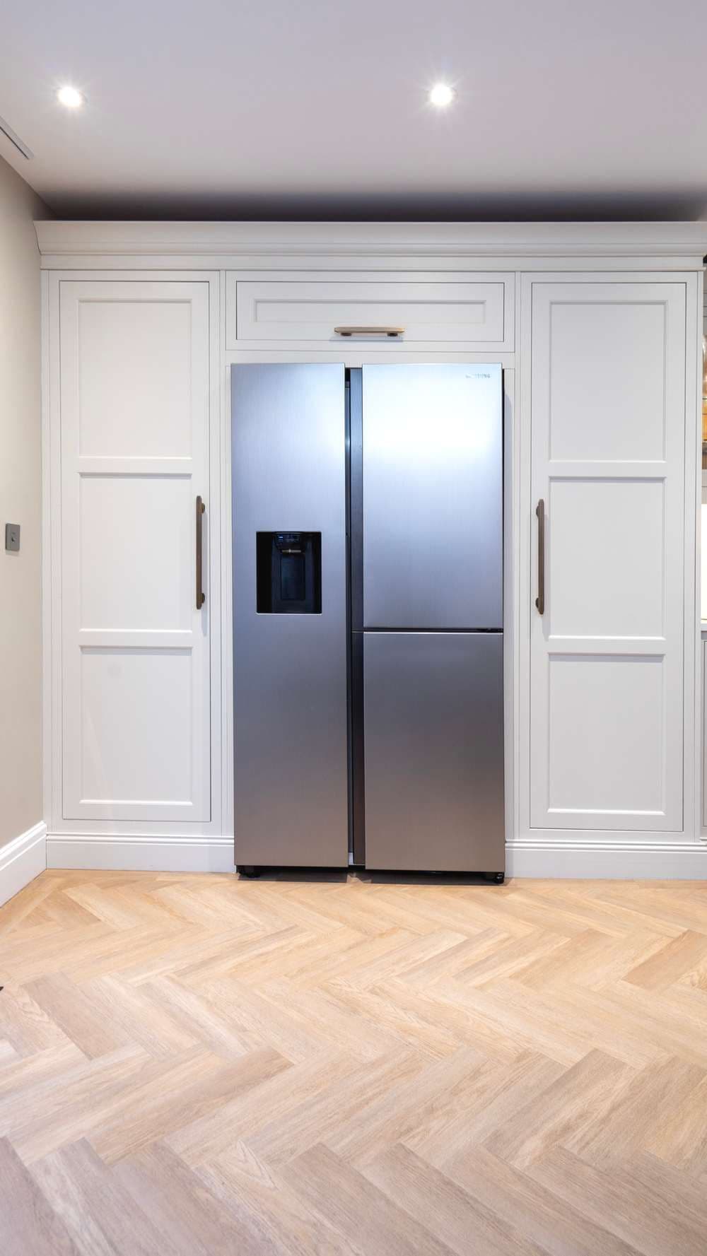 View of fridge and storage area