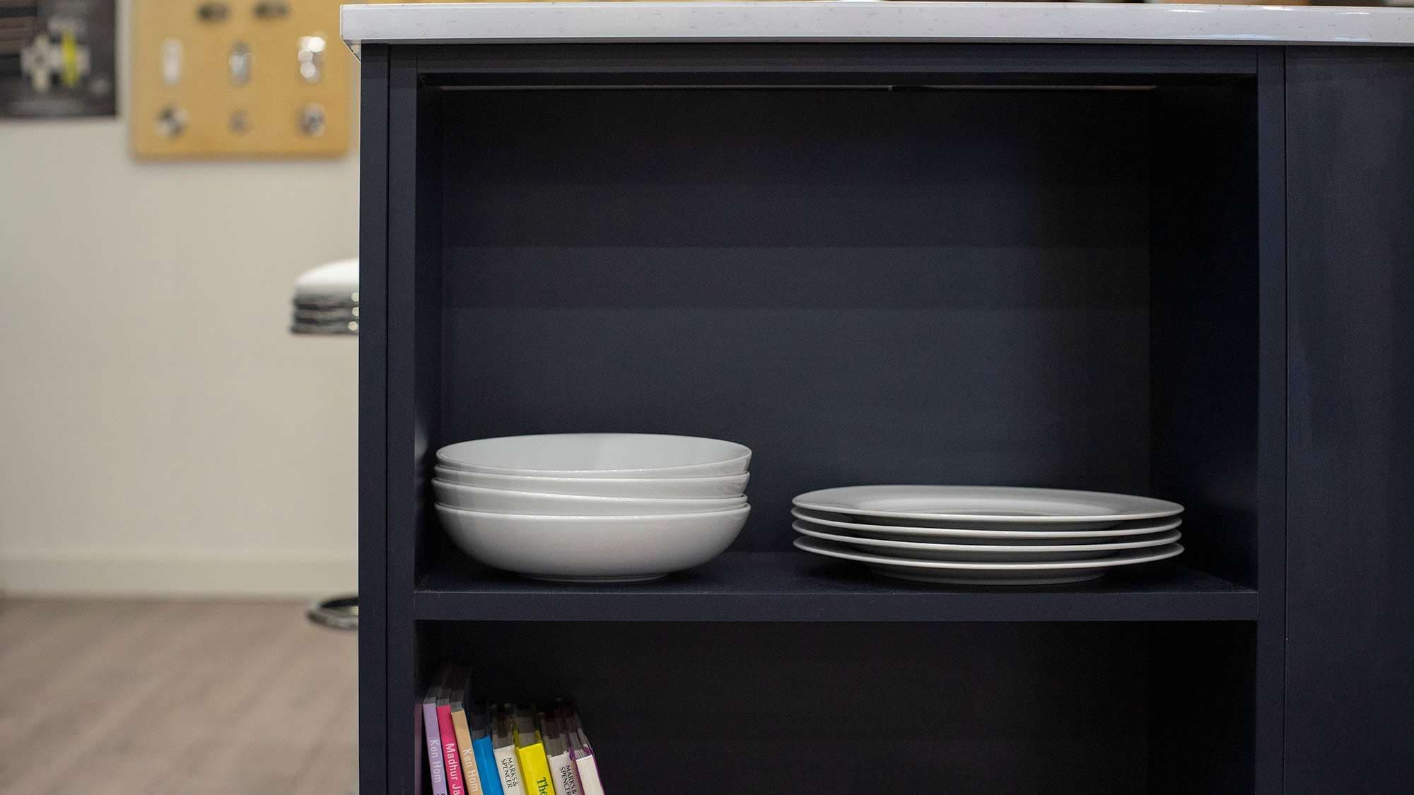 Open display shelving with white crockery