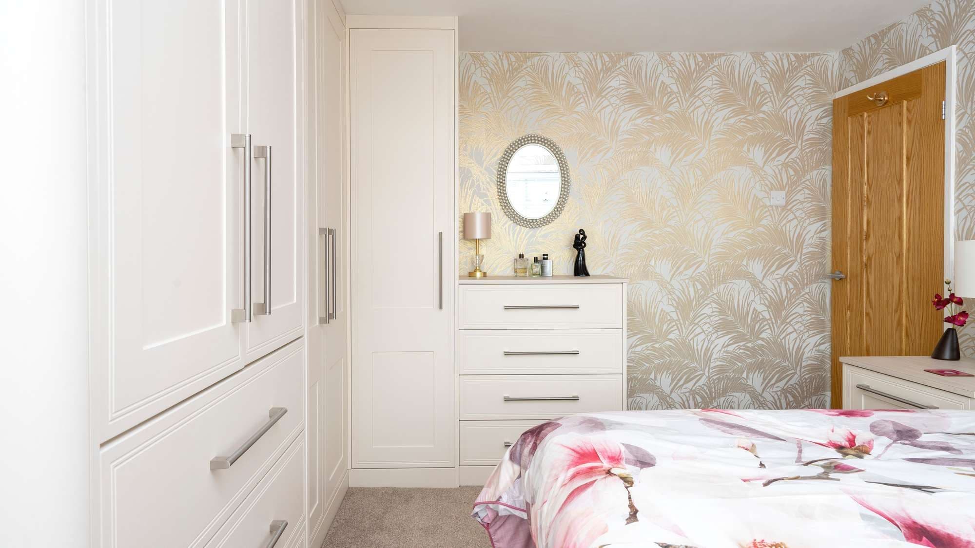 Alternative view of cream shaker wardrobe installation.