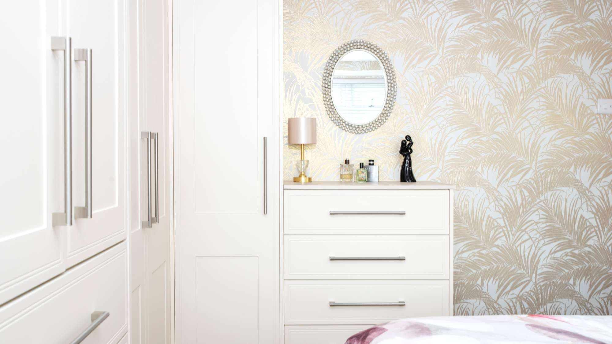 Close up view of cream shaker wardrobe installation.