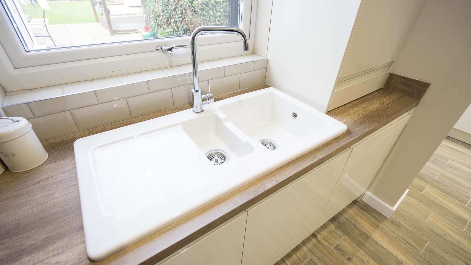 Close up of the porcelain sink area with chrome tap.
