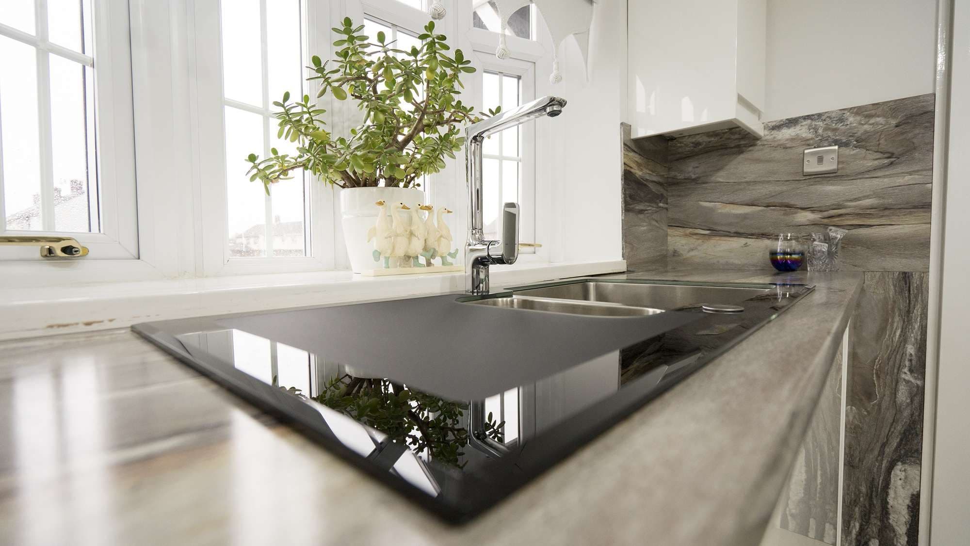 Another view of this kitchen sink with stunning chrome handle.