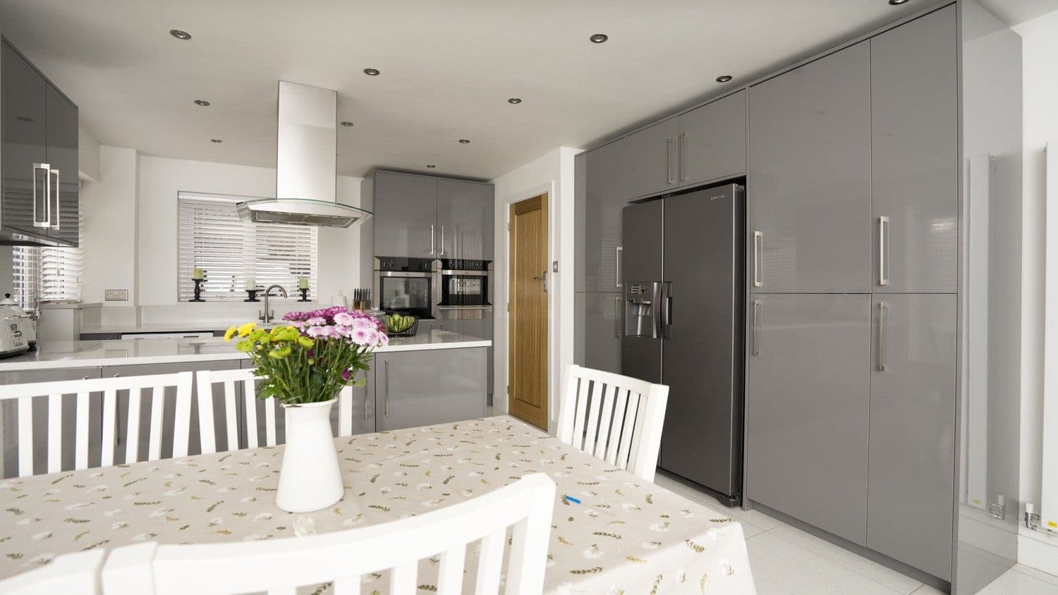 Floor to ceiling cupboards and central island give this kitchen the wow factor and make it a great space for both entertaining and day to day living.