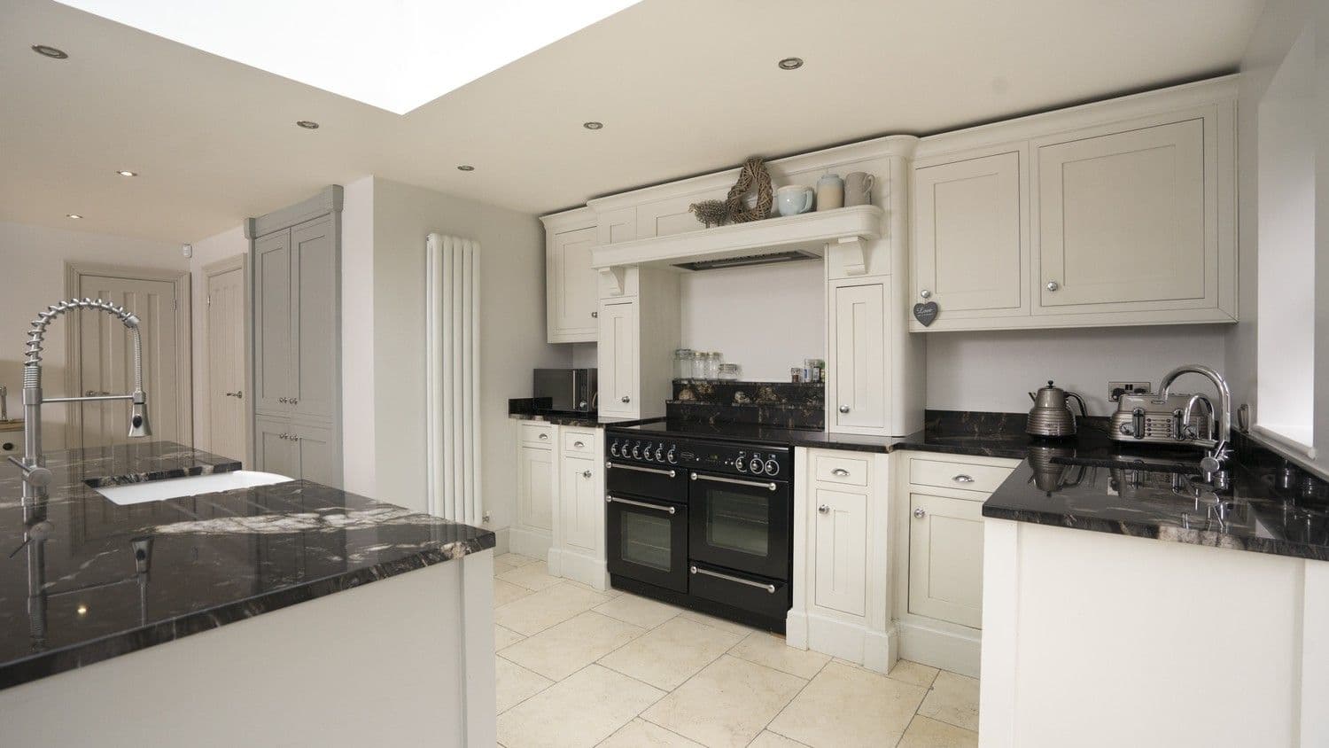 Another angle showing the stunning feature mantel piece which houses the ovens extractor fan.