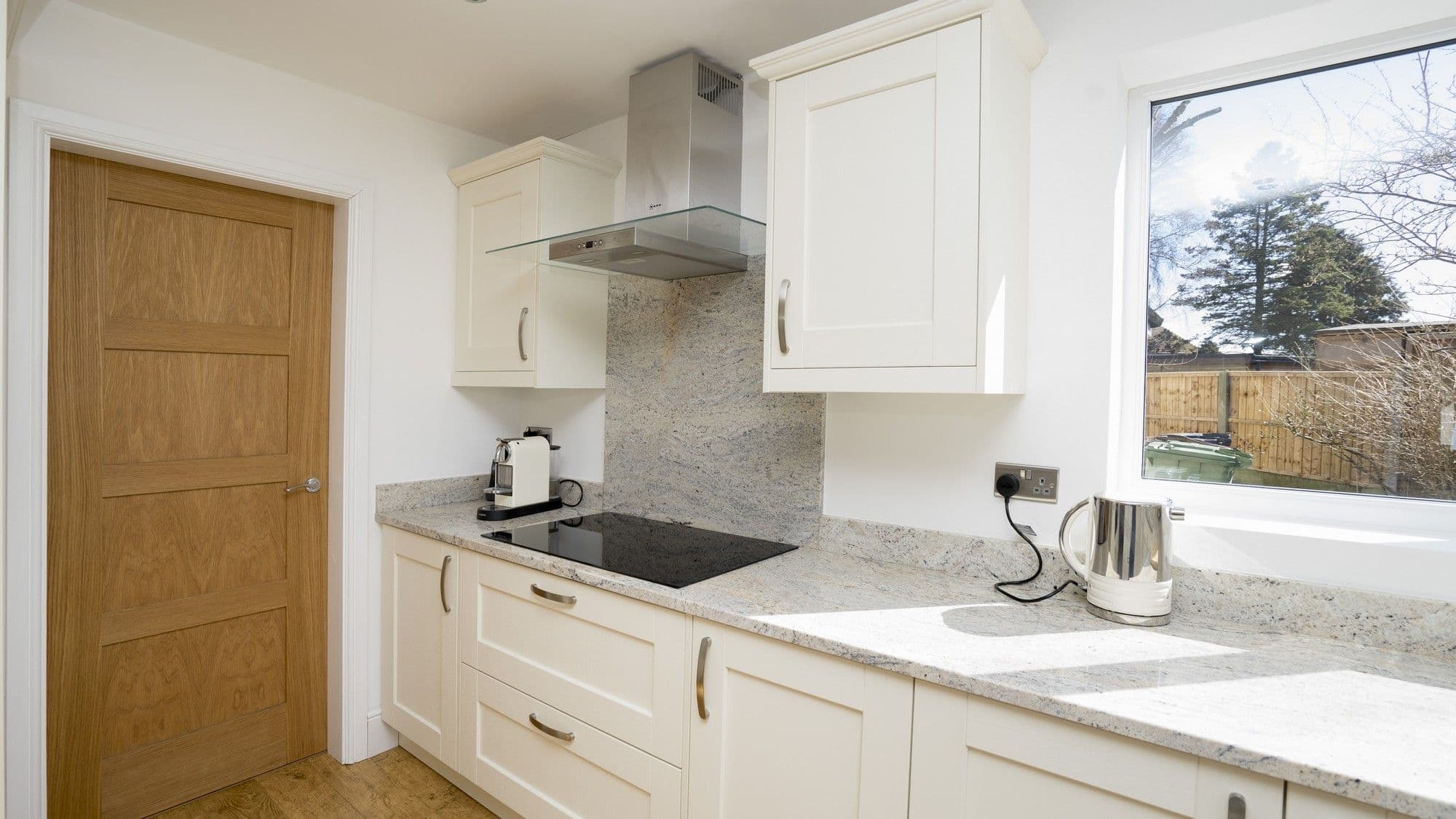 Close up of the cooking area showcasing the Neff hob and extractor.