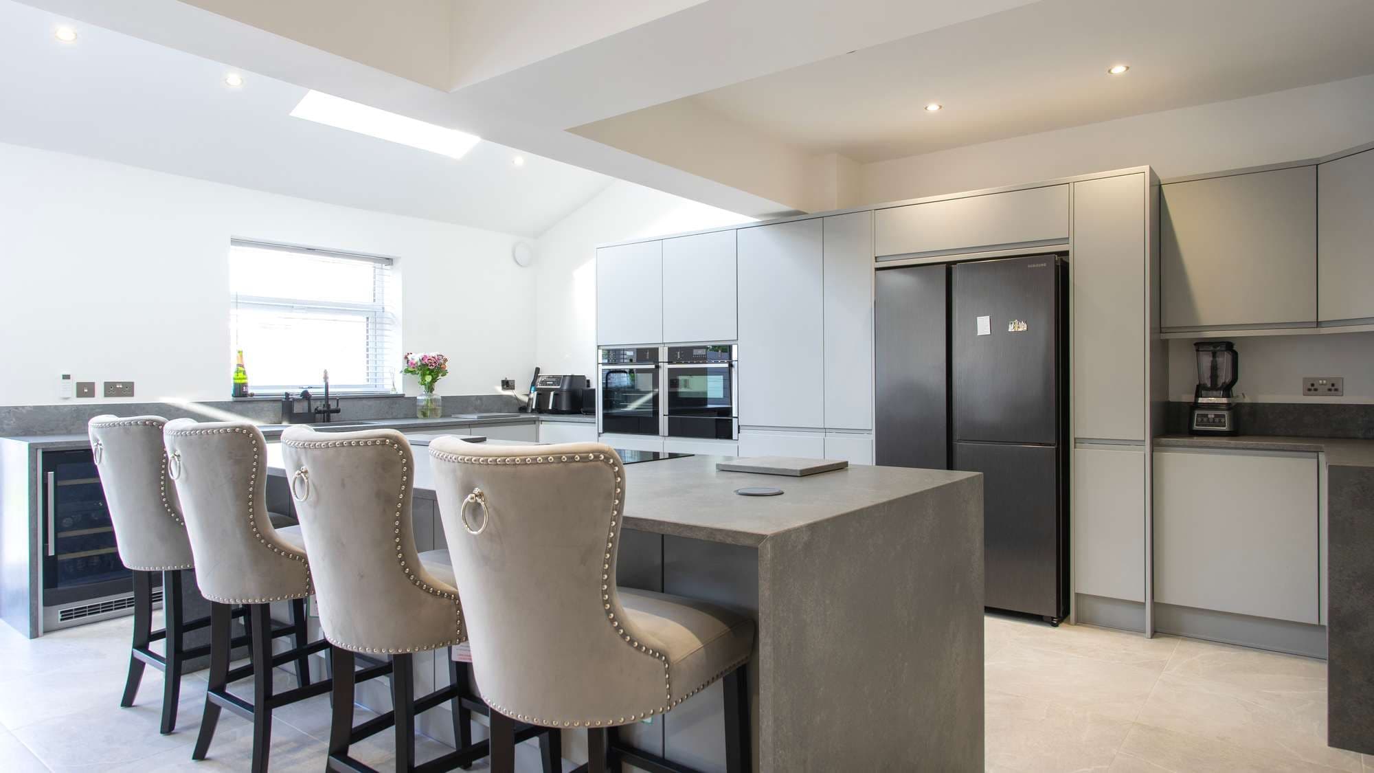 Overview shot of the matt grey handle-less modern kitchen.