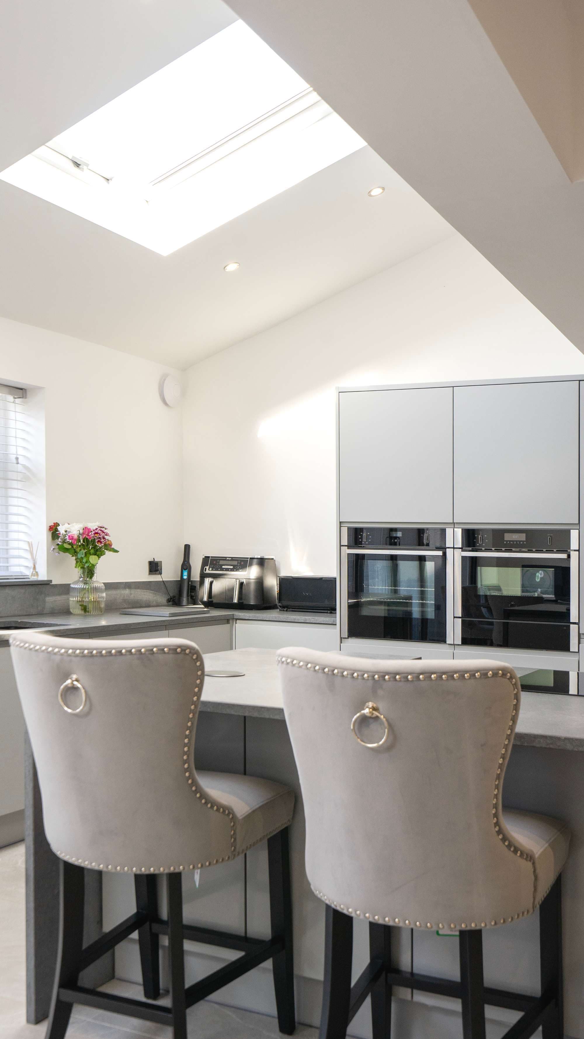 Vertical view of kitchen ovens and chairs, Liverpool.