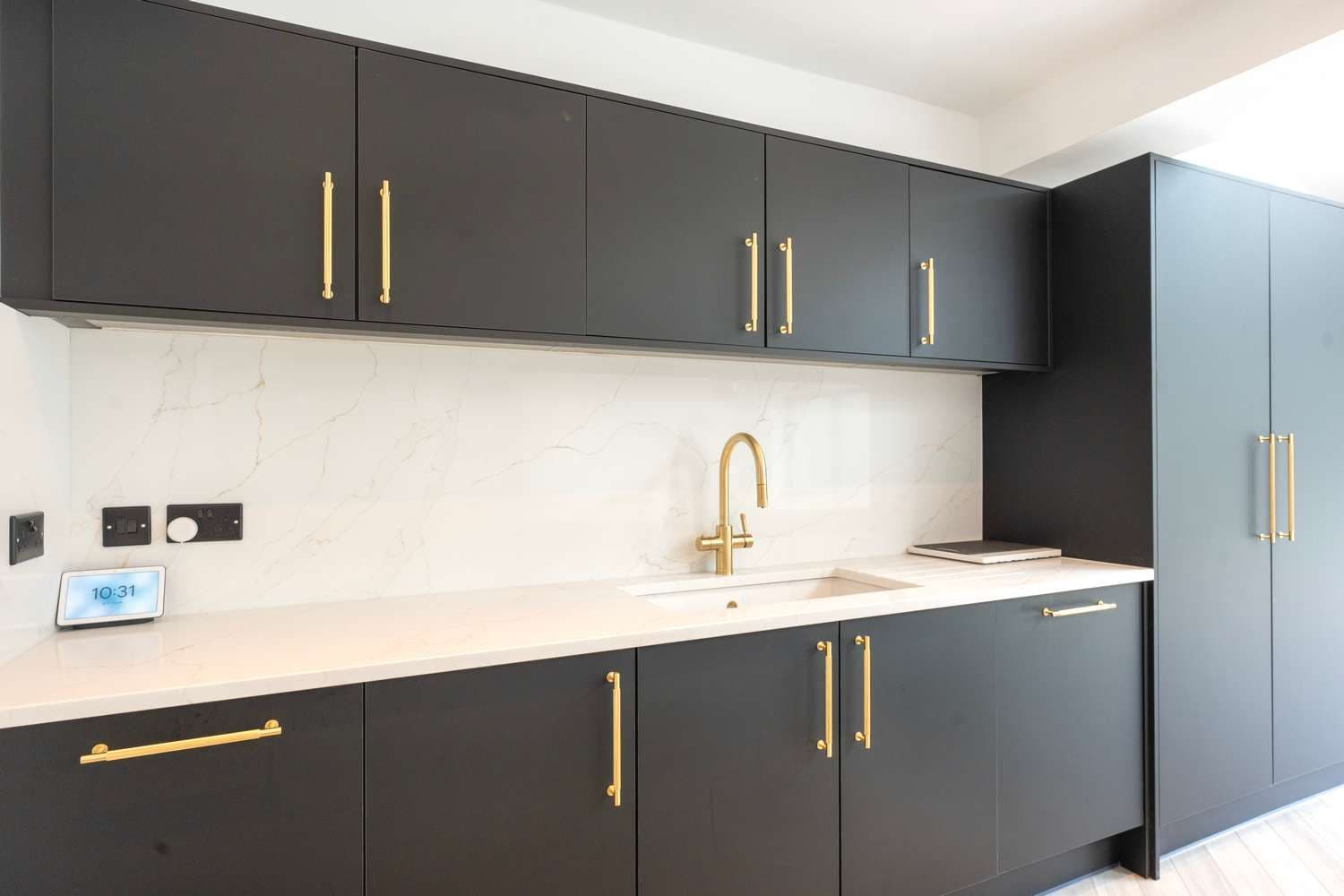 Slight angle view of kitchen cupboards.