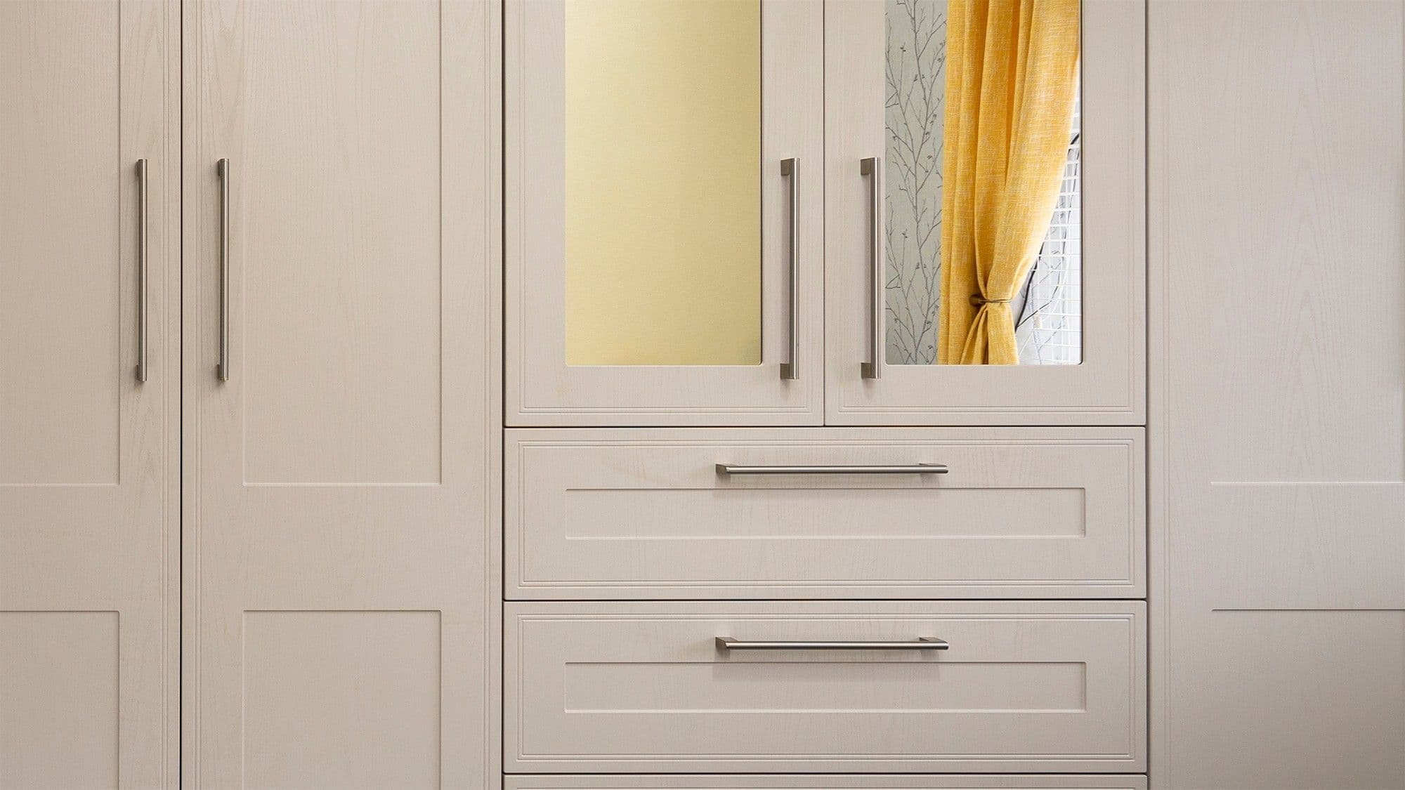 Straight on view showing the wood-grain effect and stainless steel handles of our tulleymore door collection.