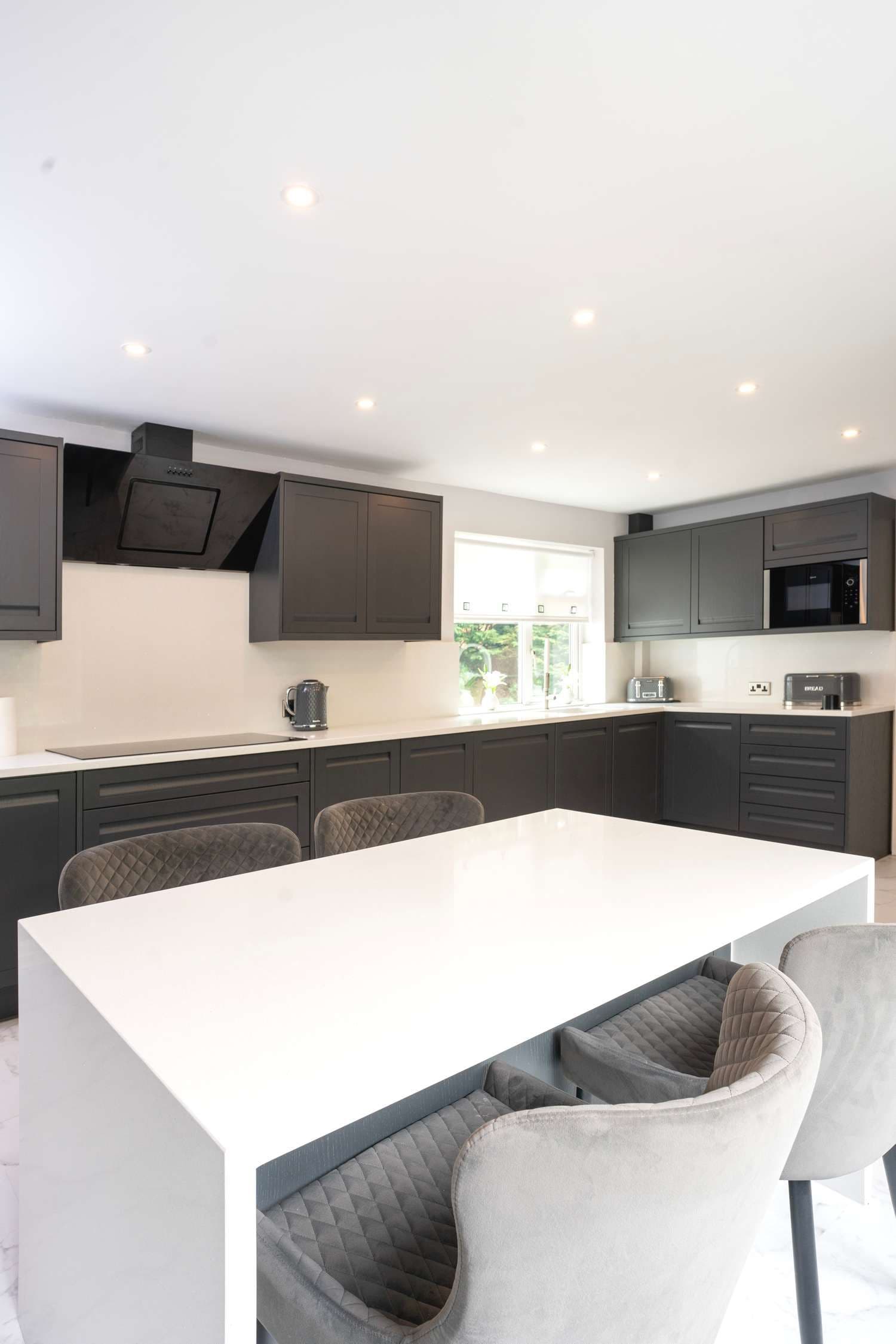 View of main utility area of this stunning kitchen including cooking hob and sink.