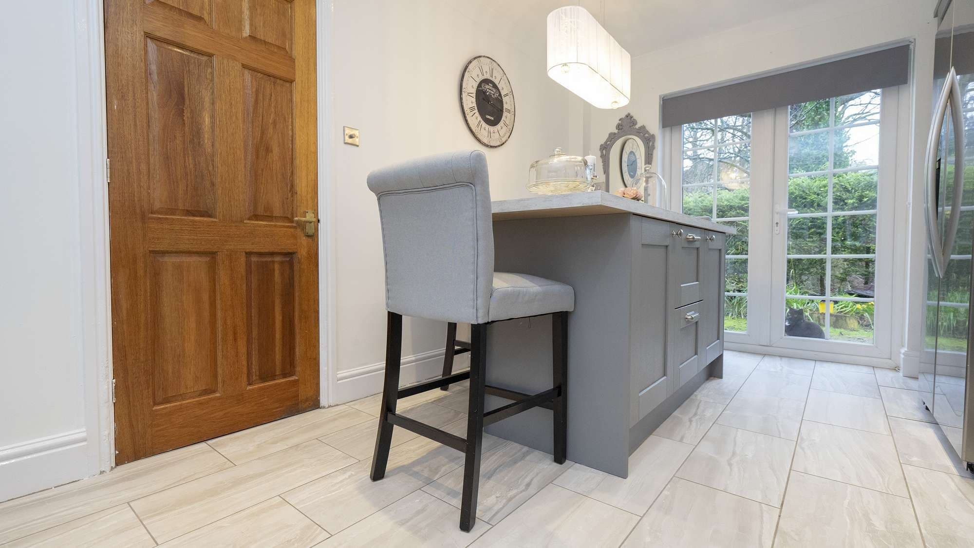 Close up of the kitchen island with matching seating.