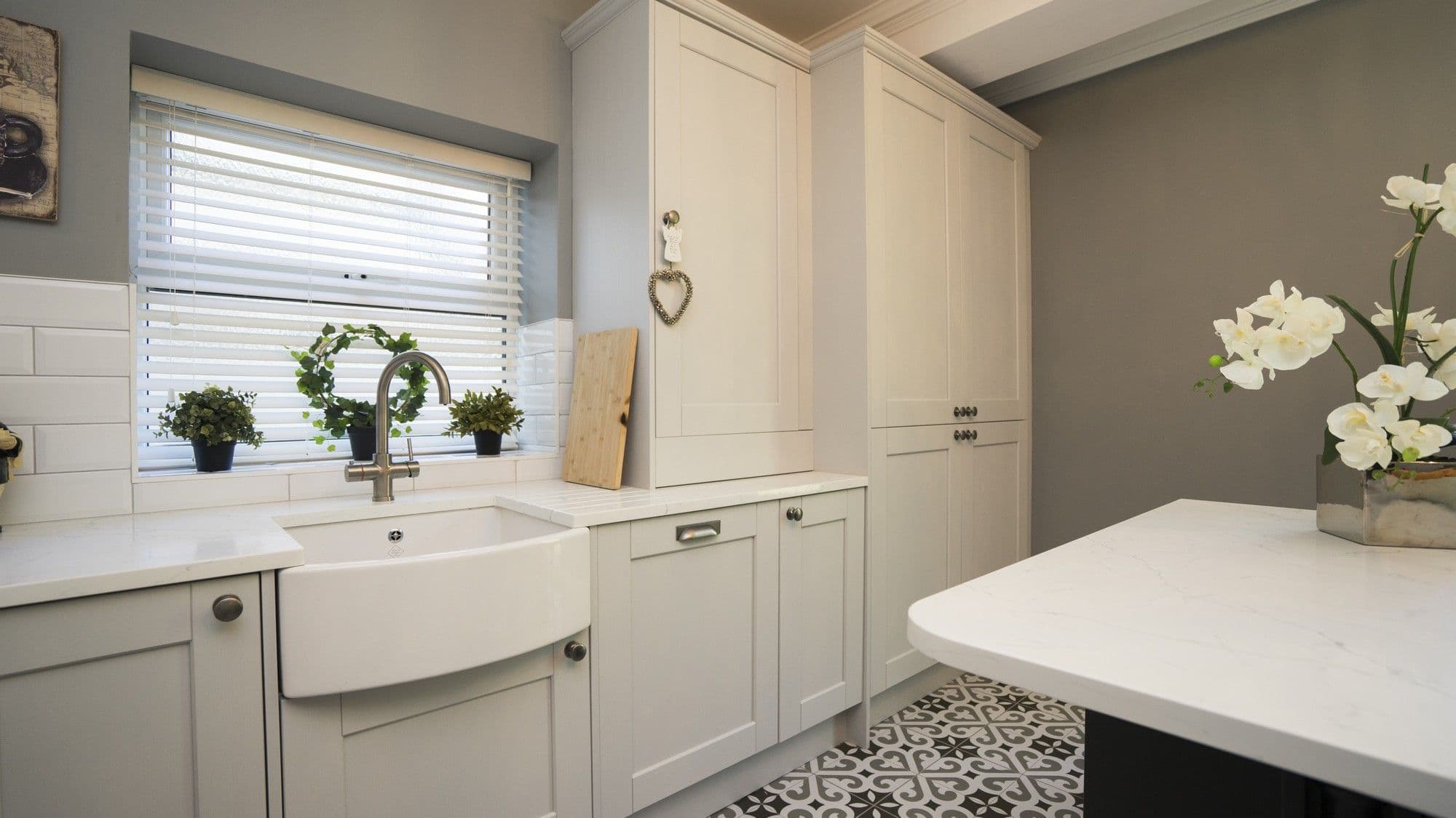 Sink area with instant boiling water tap, lots of storage and built in appliances here including dishwasher and fridge/freezer.