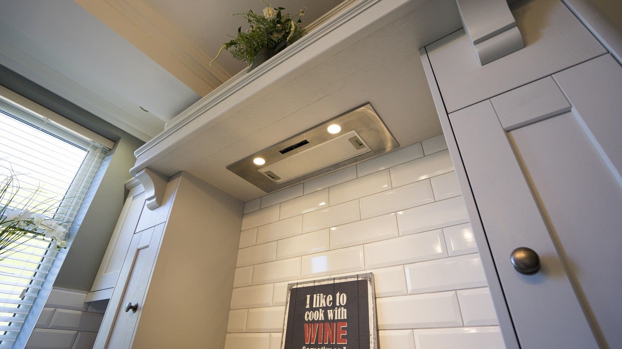 Close up of the extractor fan built into the timber mantel.