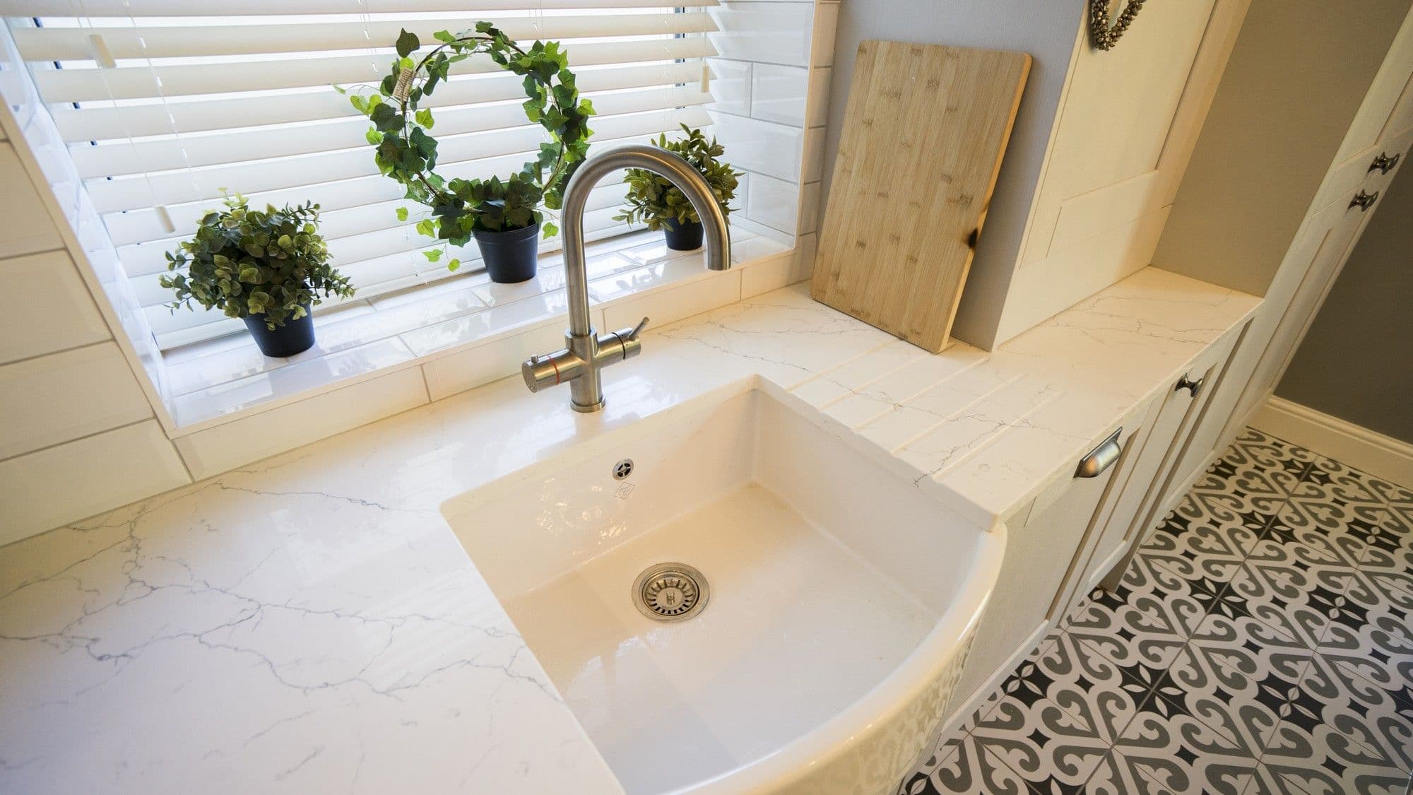 Close up of the sink, granite detail and boiling water tap.