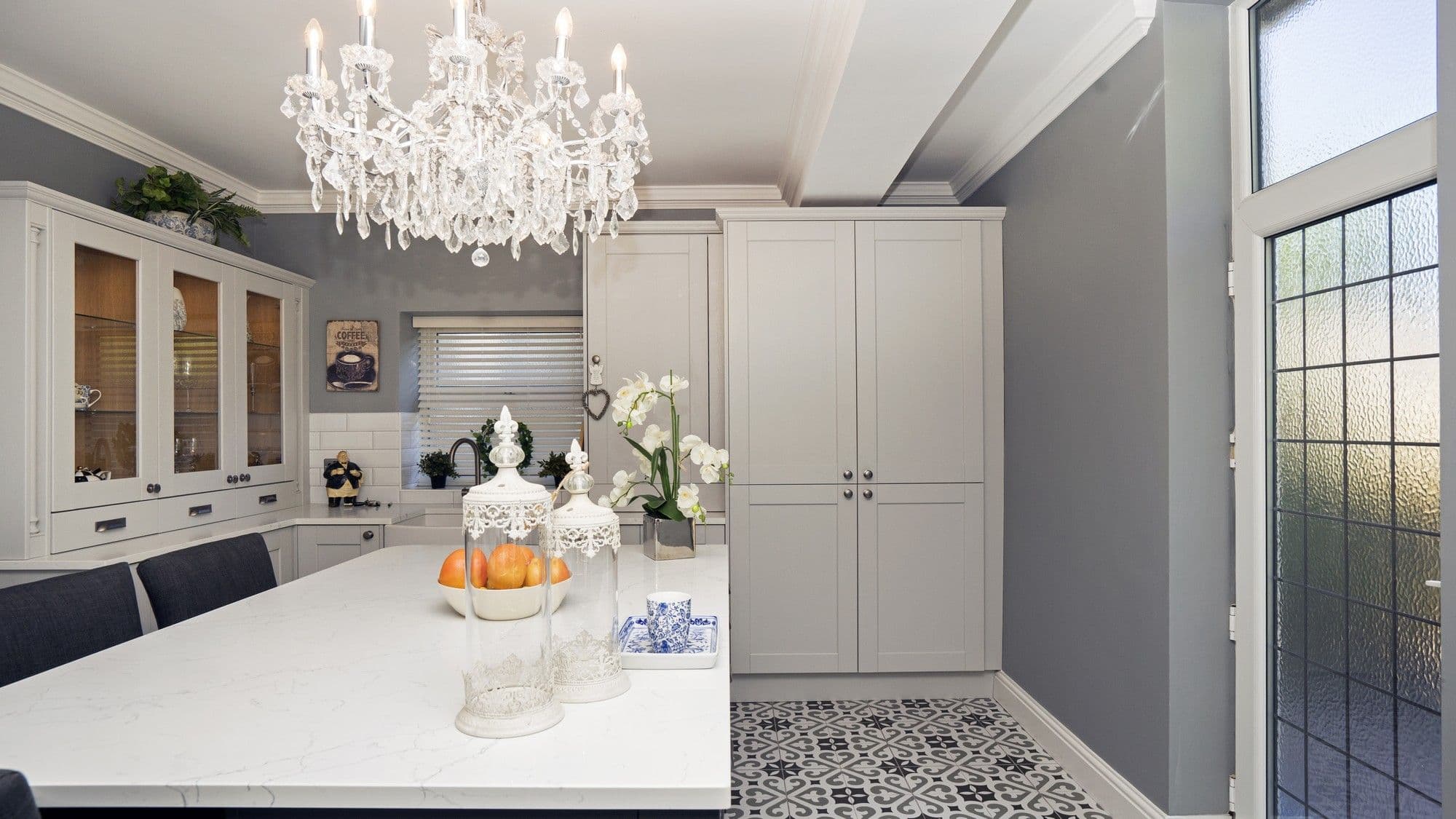 Straight on view of the kitchen island perfect for dining and entertaining with the added bonus of storage space.