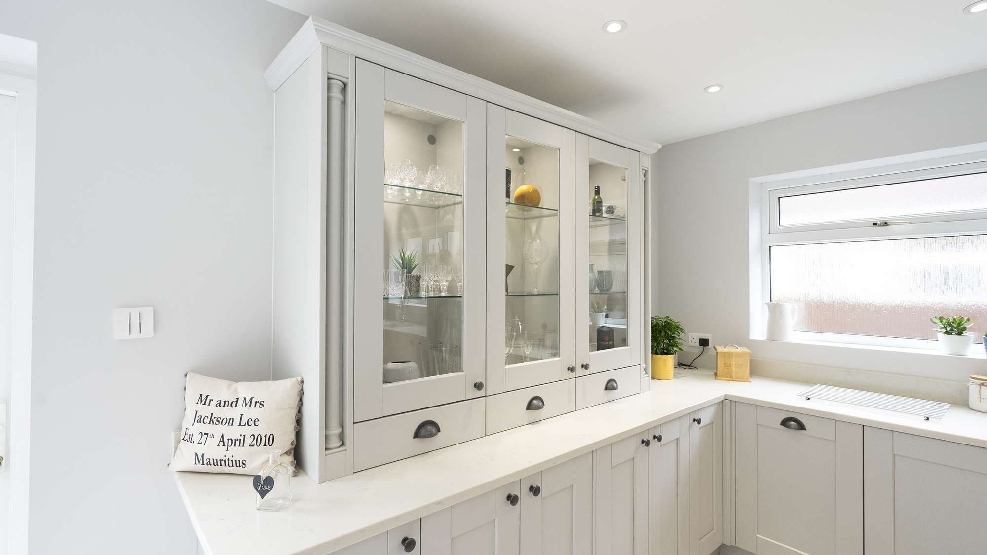 Glass display cabinets with newel posts adding character to this space.