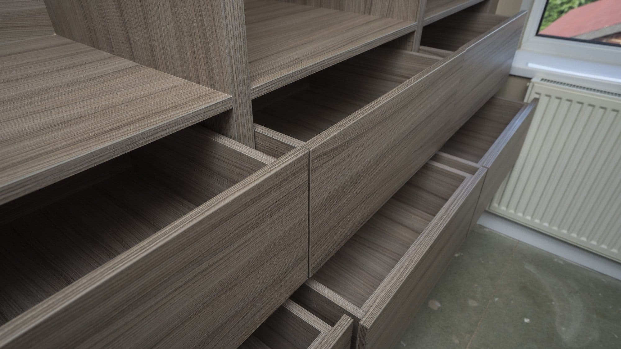 Close up of the 6 drawers on the left side of the walk in wardrobe, Wirral.