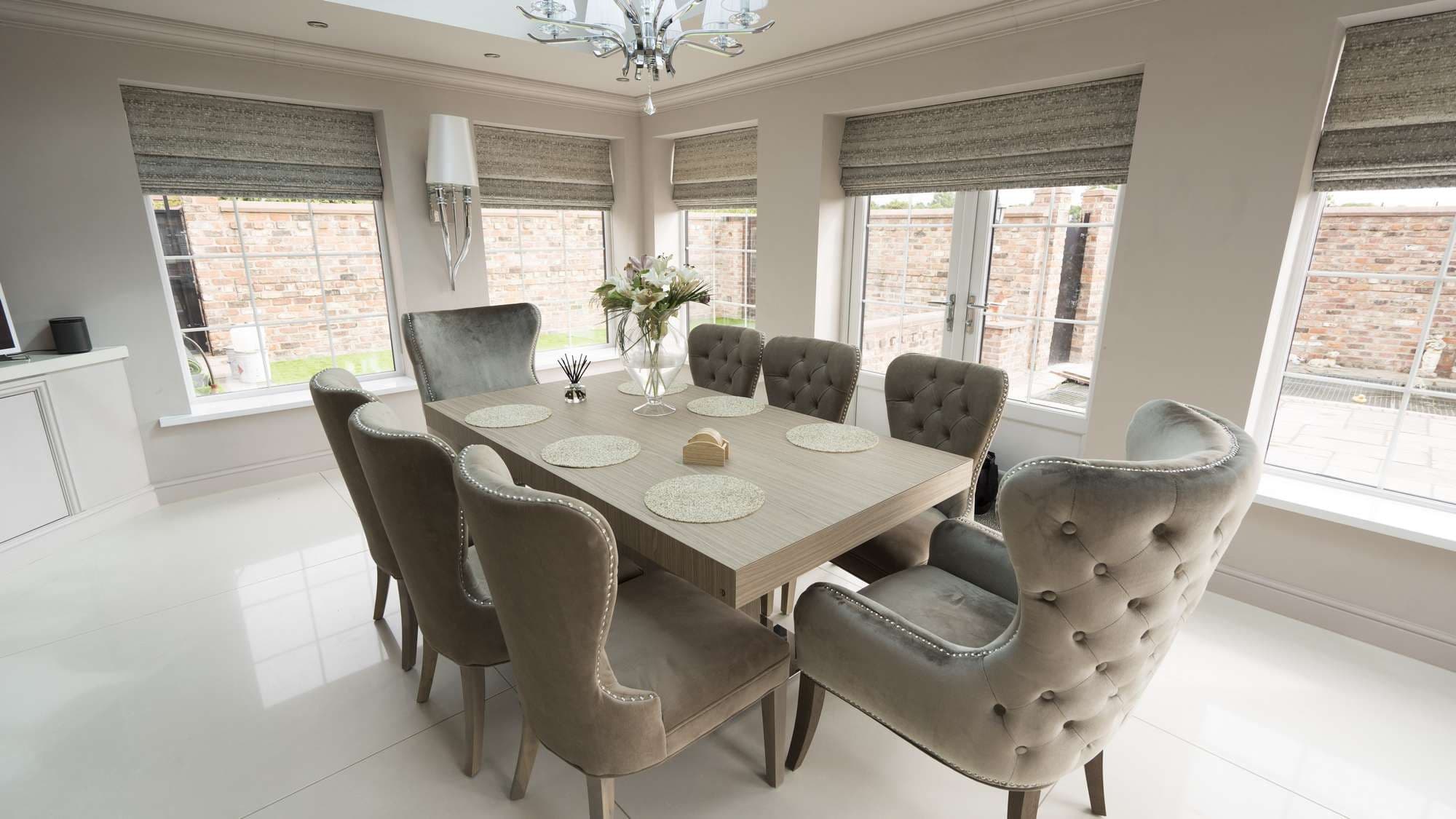Custom dining table with button backed chairs in Liverpool kitchen.