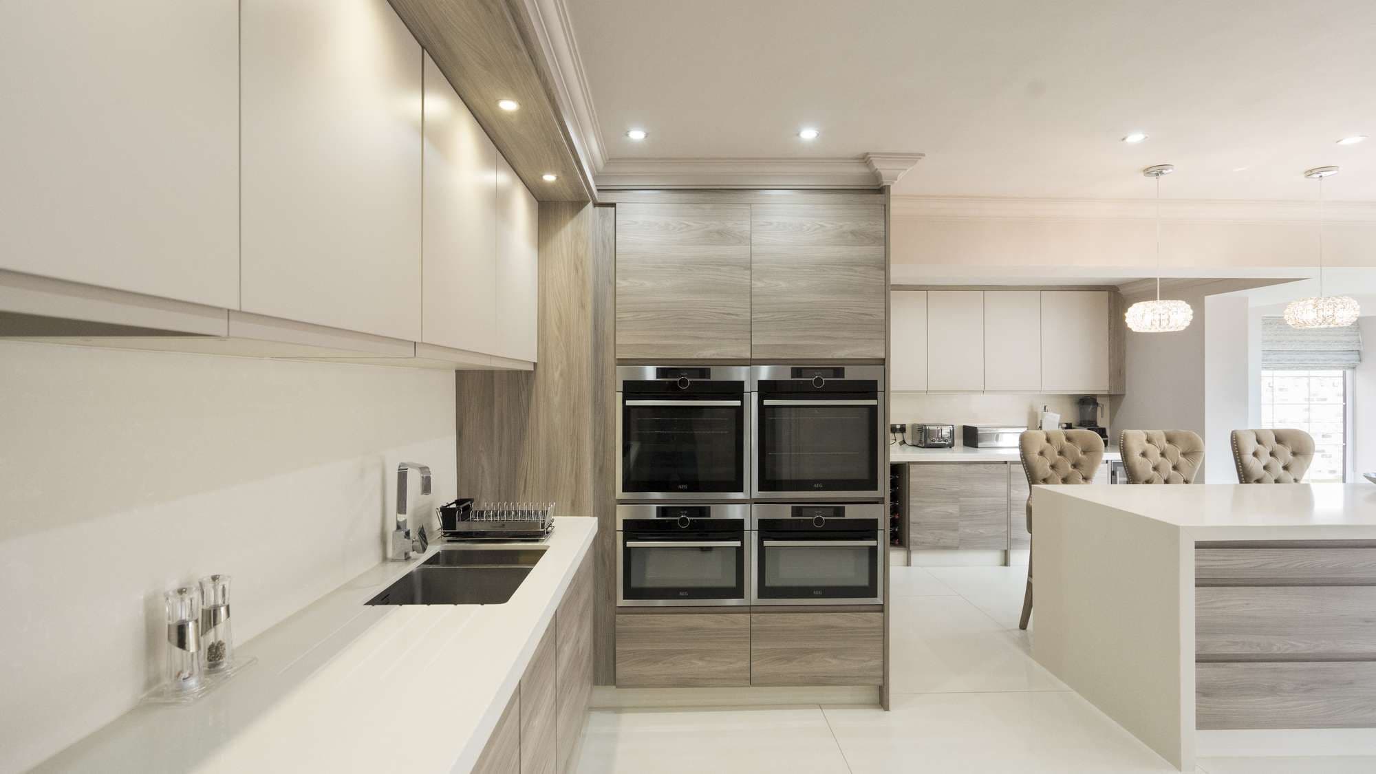 Close up of the cooking area in this Liverpool kitchen with a series of cooking appliances and integrated sink.