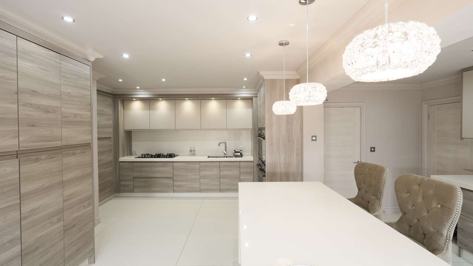 Straight on view of this designer handle-less kitchen installed in Liverpool.
