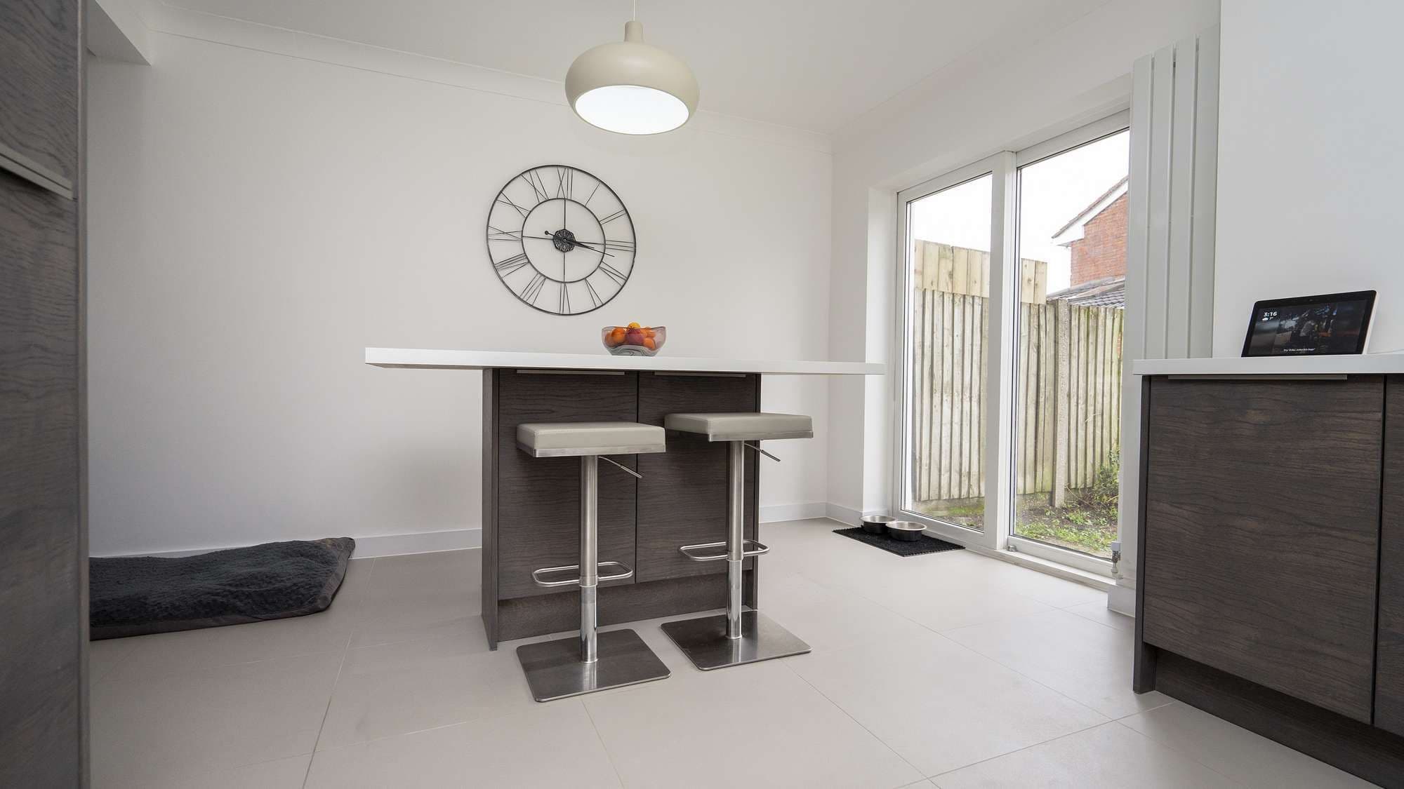 Close up of the kitchen island with featue seating and some built in storage.