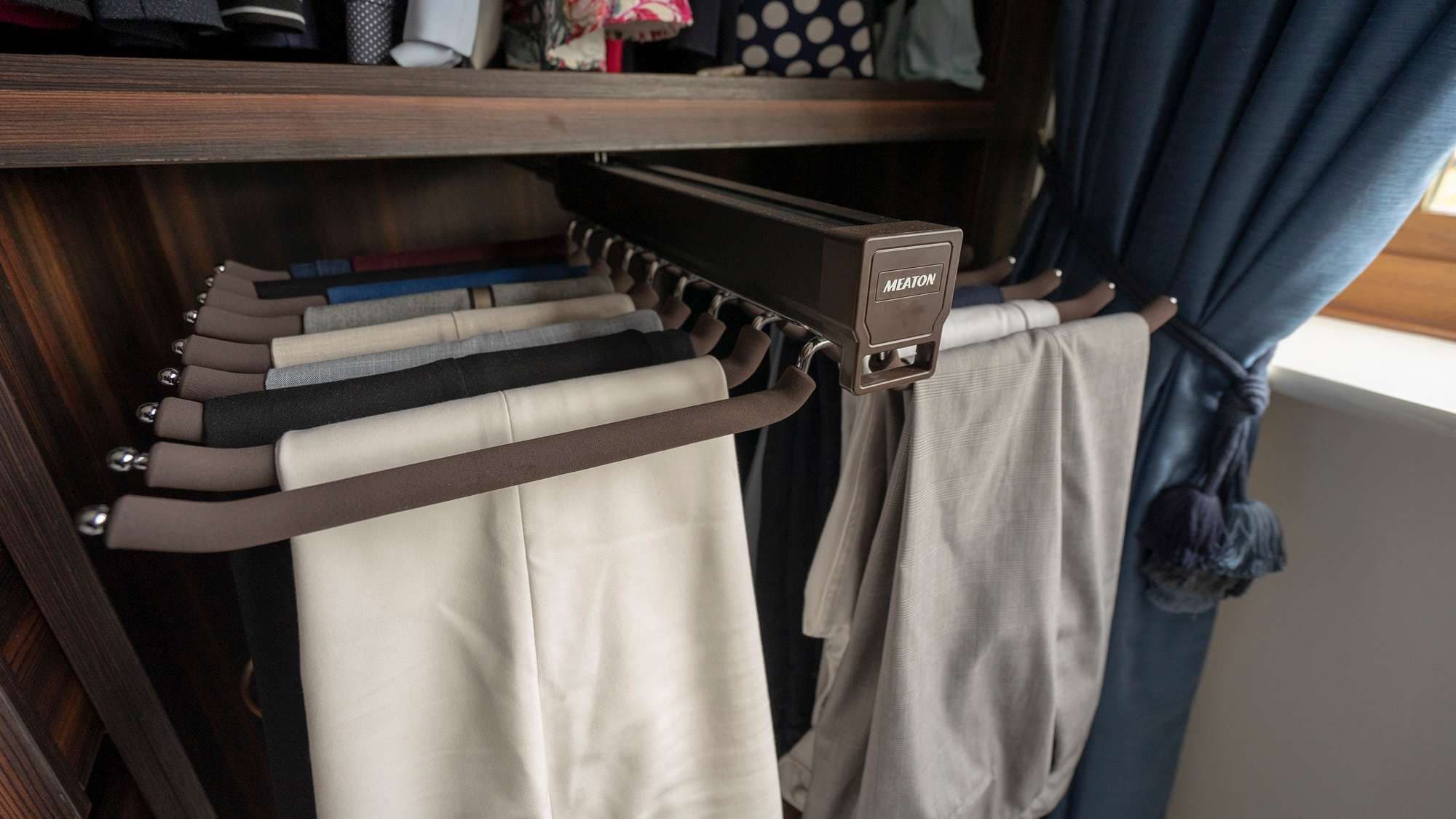 Close up shot of the pull out trouser racks.