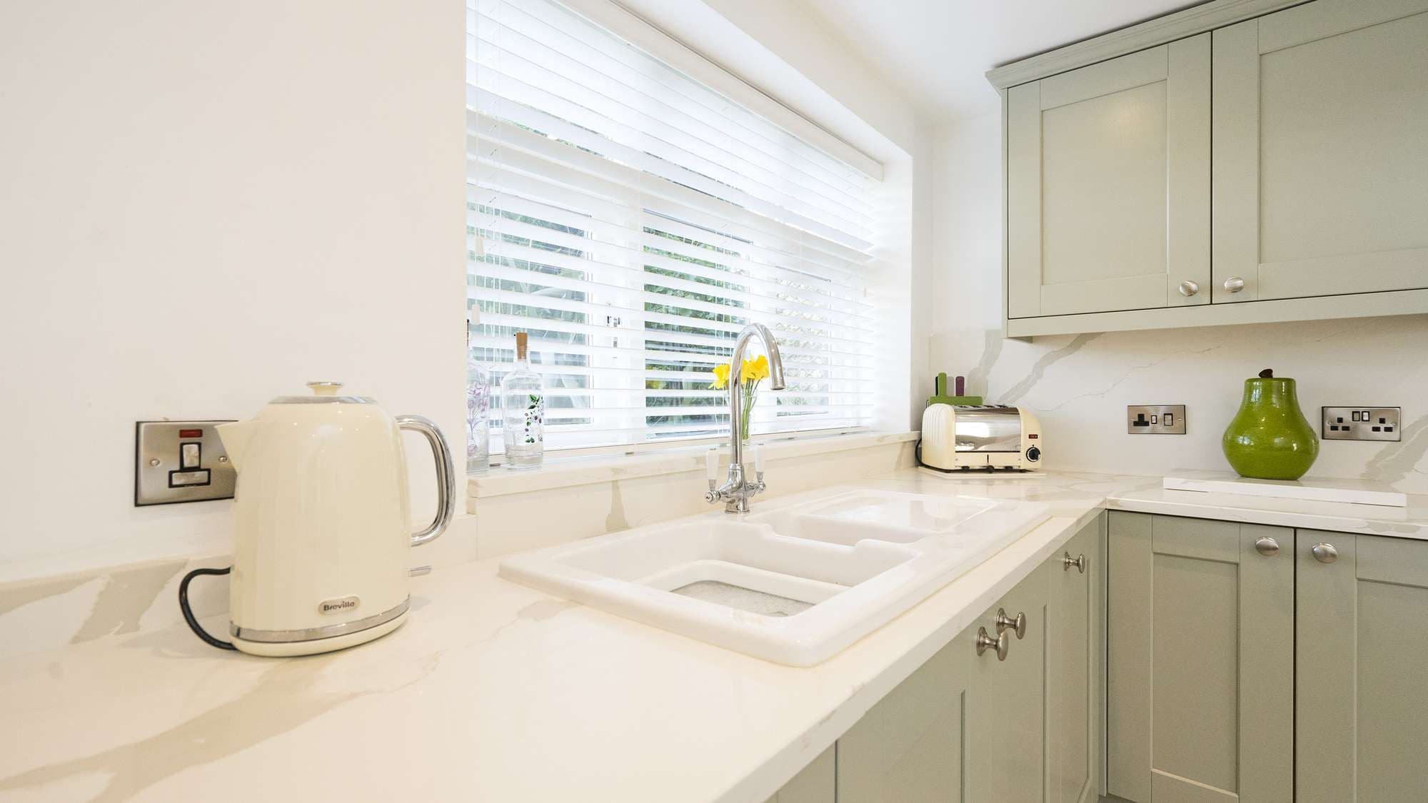 Close up of the porcelain sink and chrome tap.